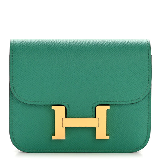 Hermes Constance Slim wallet in textured green leather with gold H clasp