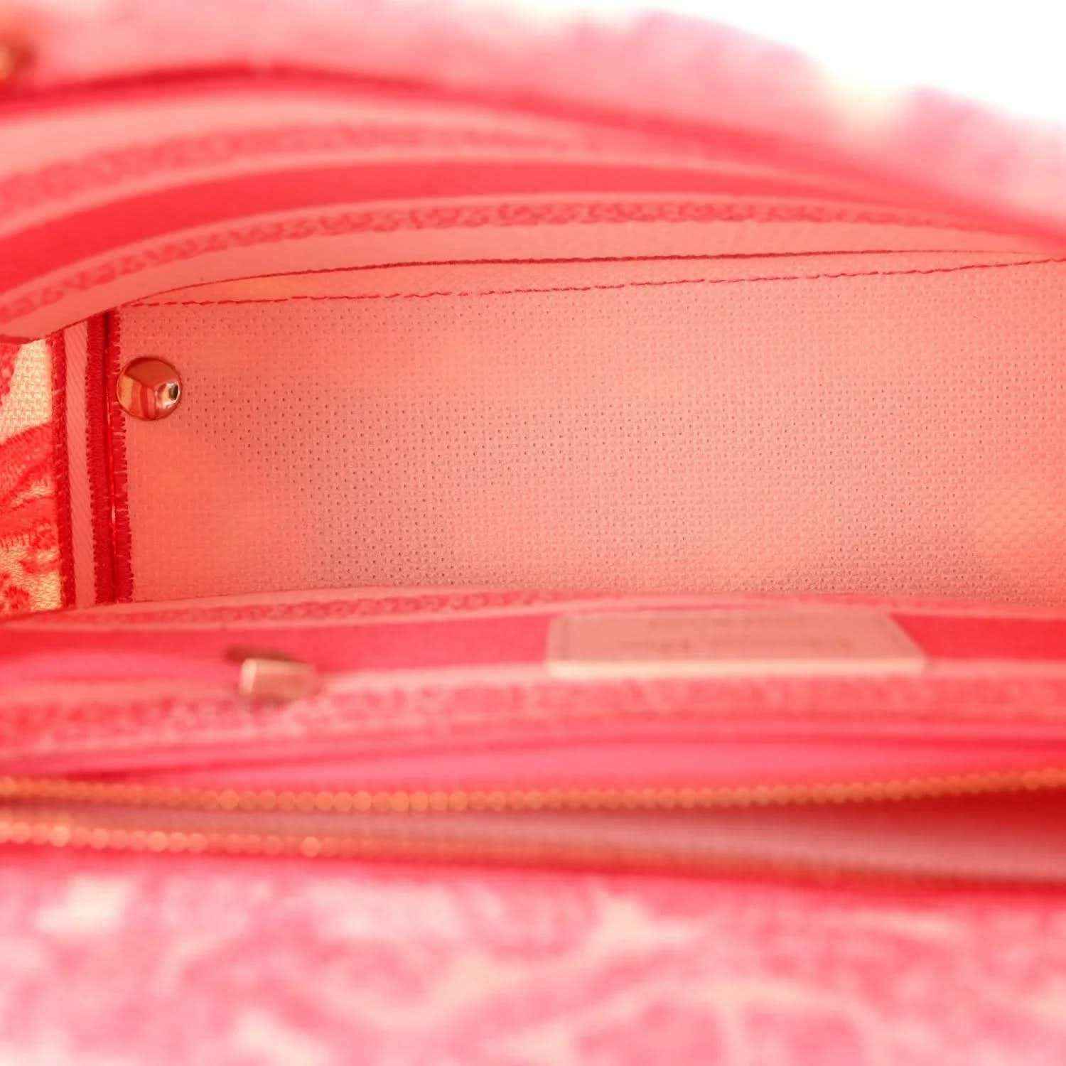 Pink fabric bag interior with zip closure and pink lining