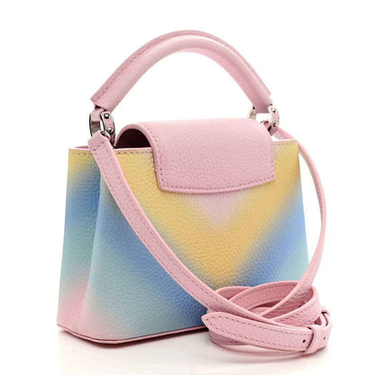Mini Capucines bag with flap closure, rainbow gradient leather and pink adjustable strap