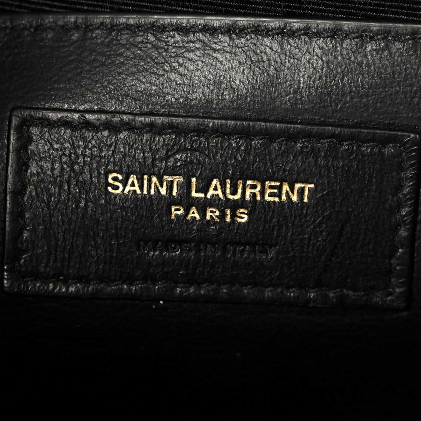 Saint Laurent Paris logo on black leather label