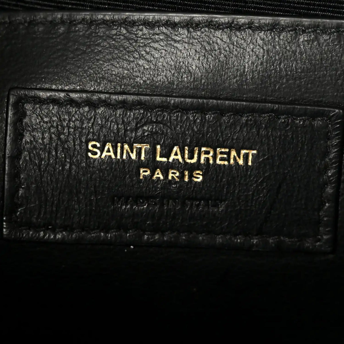 Saint Laurent Paris logo on black leather label