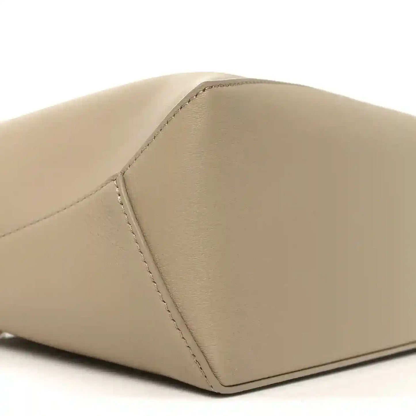 Small Puzzle edge bag corner detail, smooth beige calfskin with edge stitching