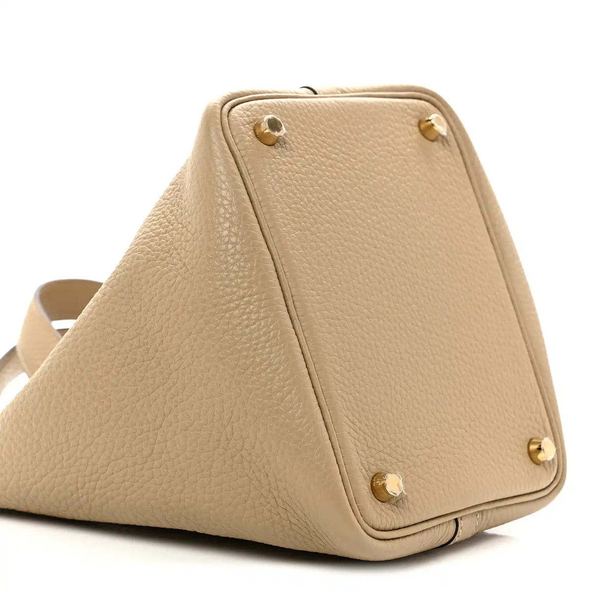 Beige grained calfskin bucket handbag side view with gold corner studs.