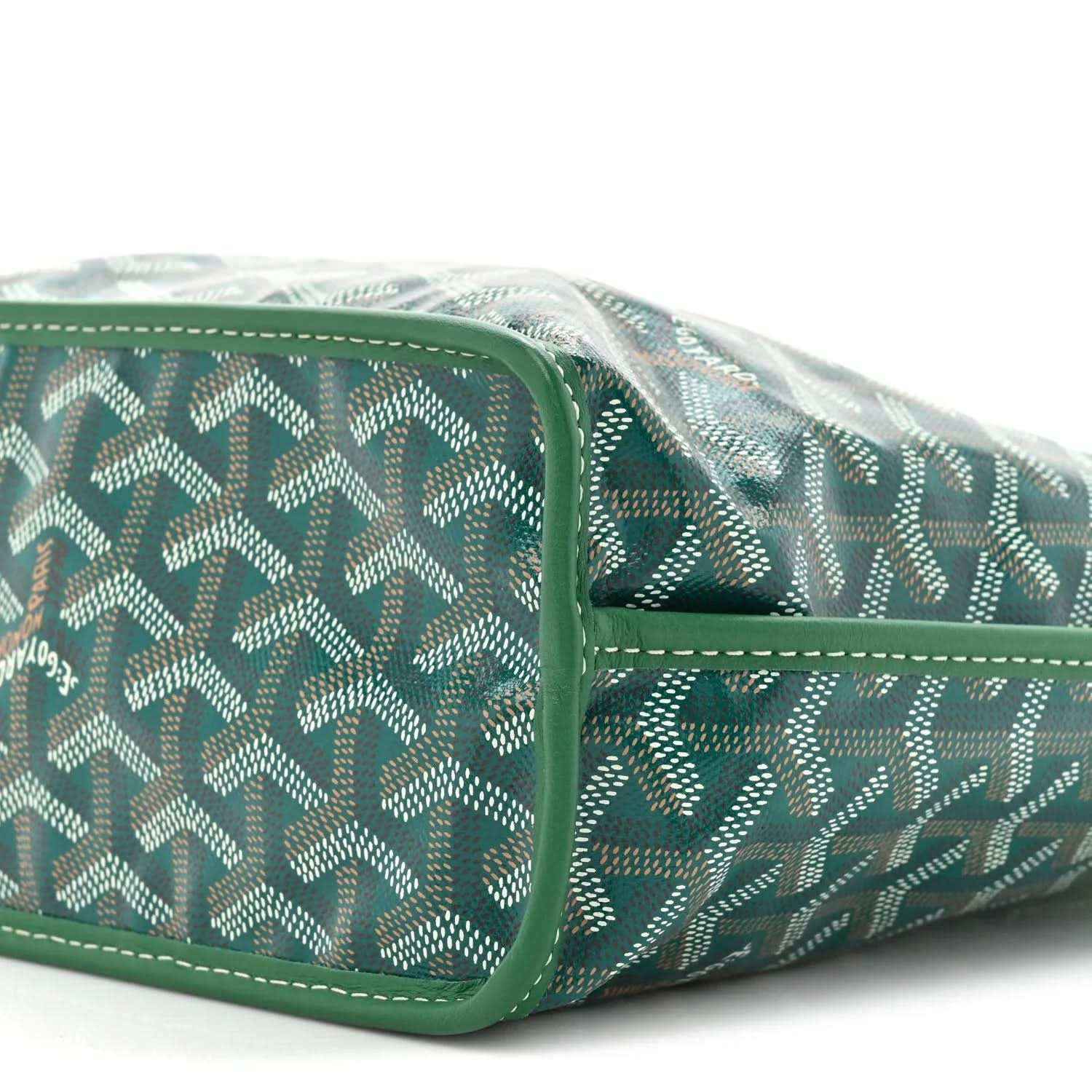 Reversible tote bag side view in green patterned coated canvas with edge piping