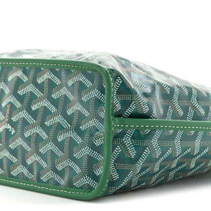 Reversible tote bag side view in green patterned coated canvas with edge piping