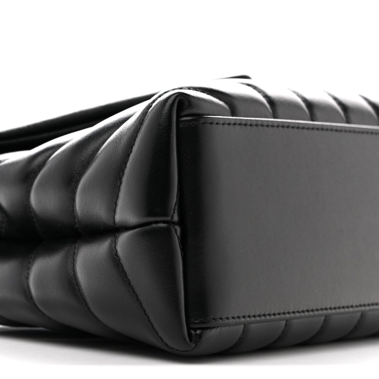 Black quilted satchel with curved side panel and chain strap