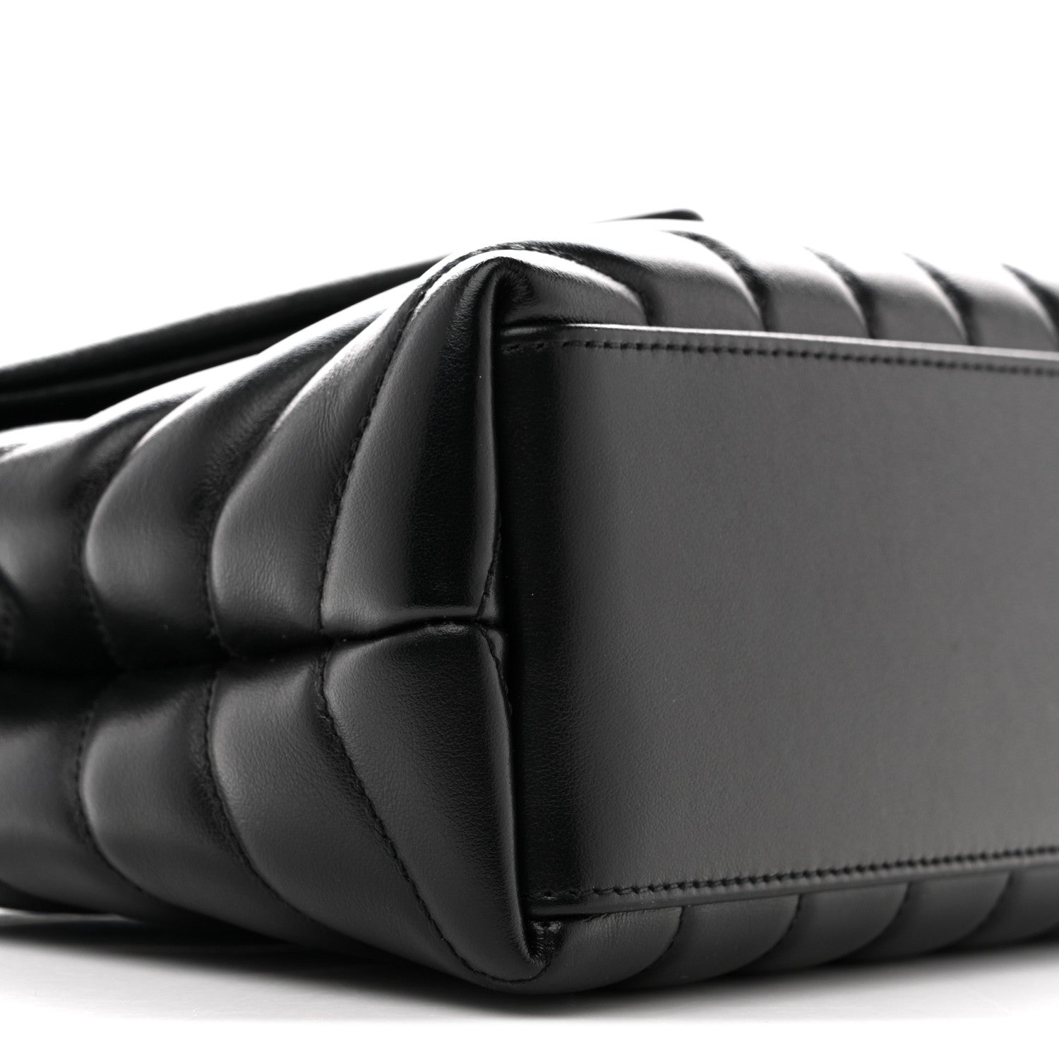 Black quilted satchel with curved side panel and chain strap