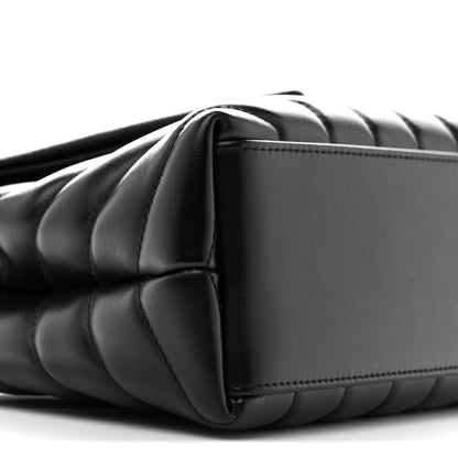Black quilted satchel with curved side panel and chain strap