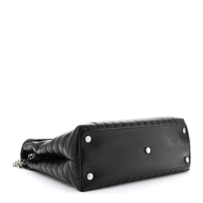 Black quilted leather satchel with silver chain and two front snaps