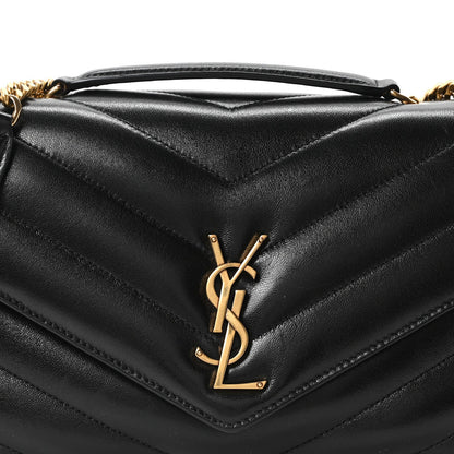 Black quilted lambskin bag with gold YSL logo plaque
