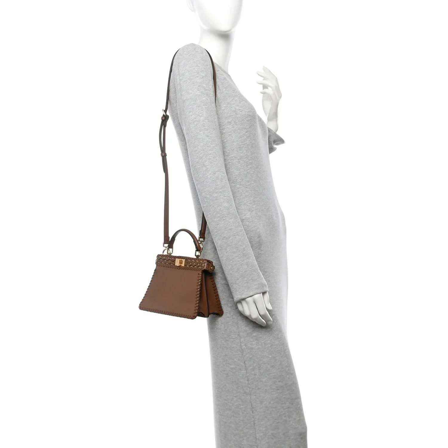 Brown woven leather satchel with crossbody strap, small front pocket, and clasp