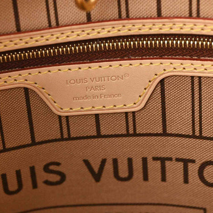Louis Vuitton tote interior label reading 'made in France' with stitched trim
