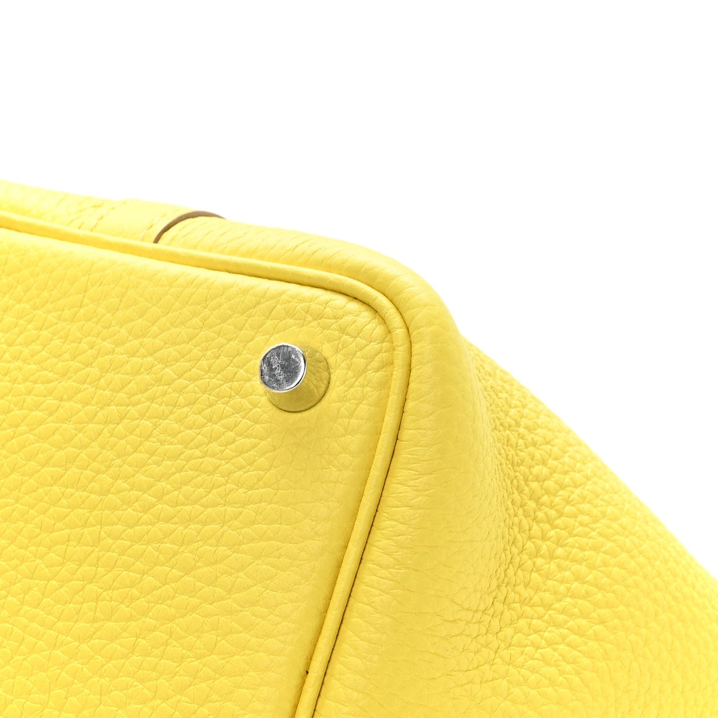 Lime leather tote side edge with round snap stud and stitched trim