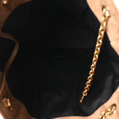 Suede tote interior with black lining and gold chain hardware detail