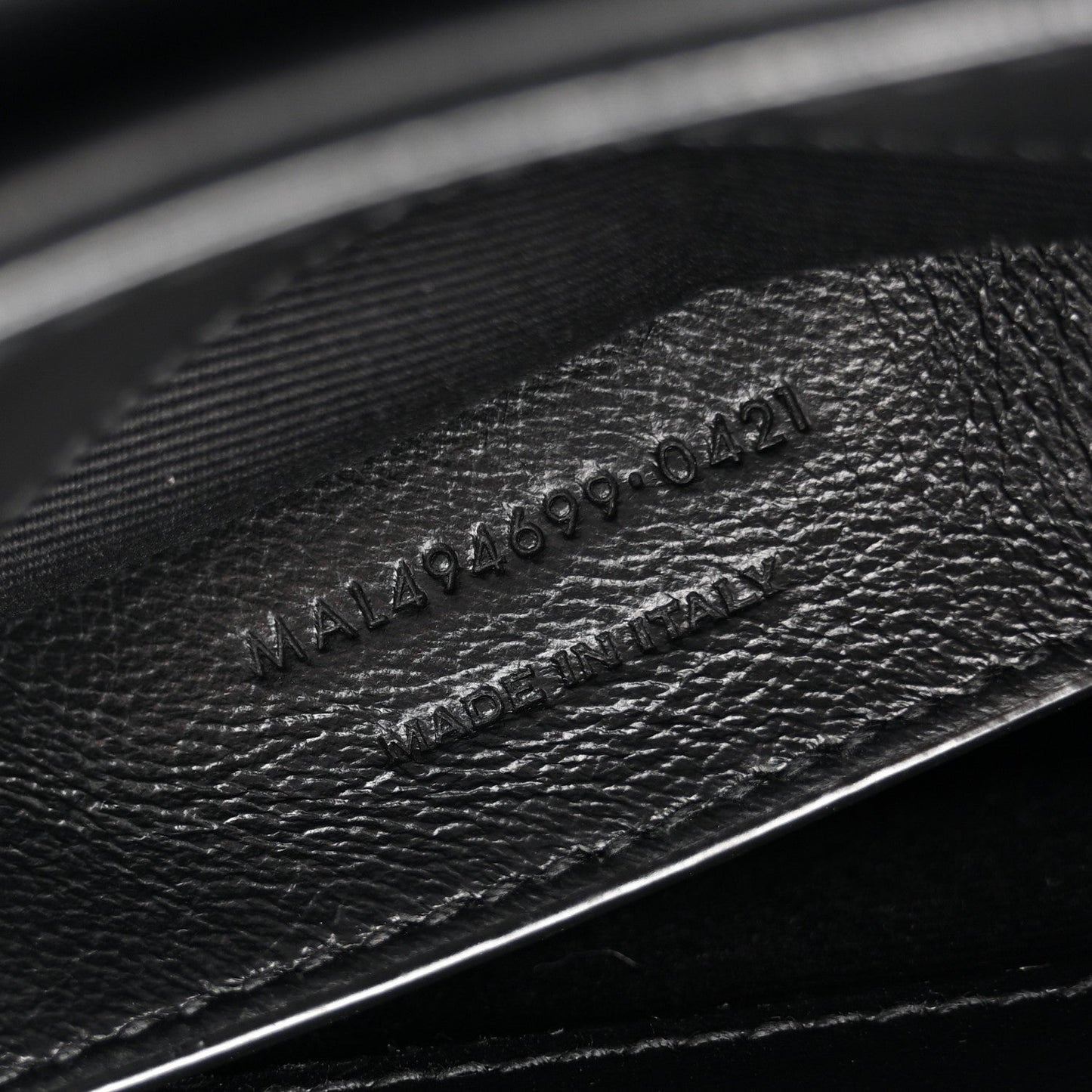 Black leather with embossed 'Made in Italy' stamp