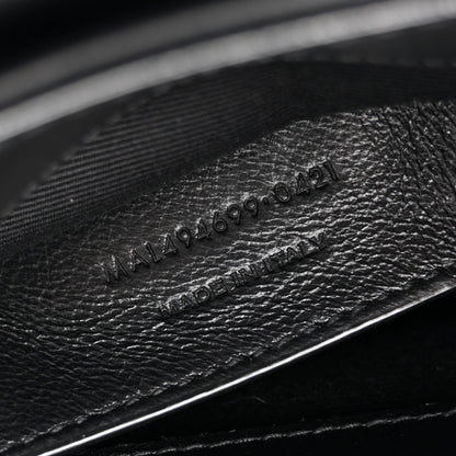Black leather with embossed 'Made in Italy' stamp