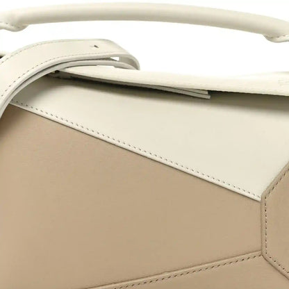 Small Puzzle edge bag top section, soft white flap and beige body with stitching