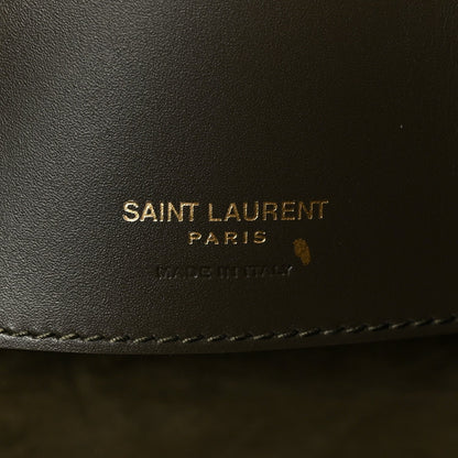 SAINT LAUREN PARIS leather stamp on dark bag lining.