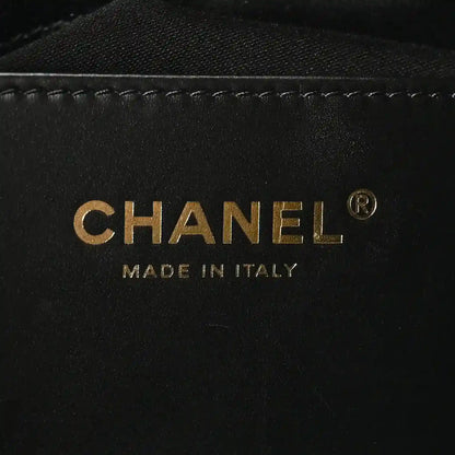 Chanel gold logo and 'MADE IN ITALY' on black leather interior