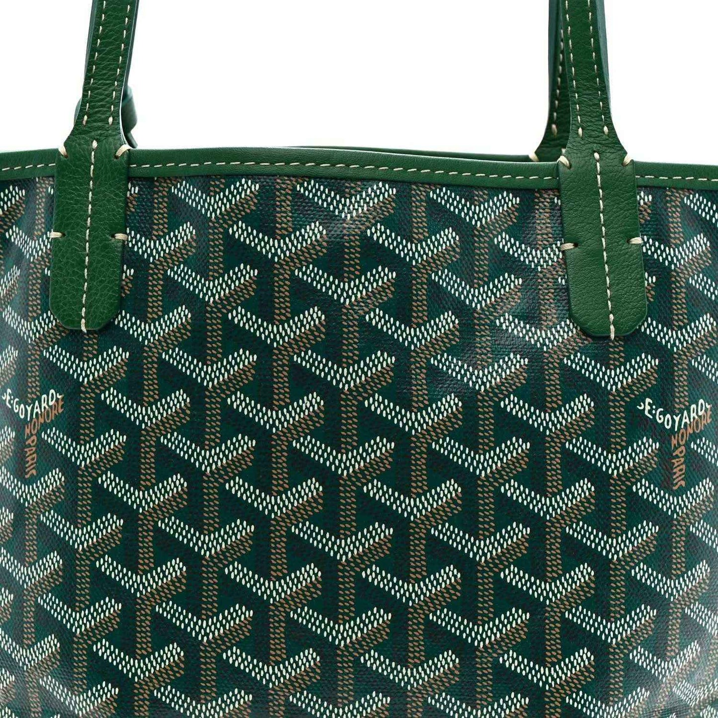 Reversible mini tote with green-trim patterned canvas and twin top handles