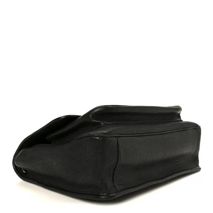 Black grained leather Niki chain satchel, front corner profile