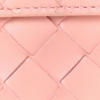 Rose pink nappa leather clutch, intrecciato pattern panels and stitching