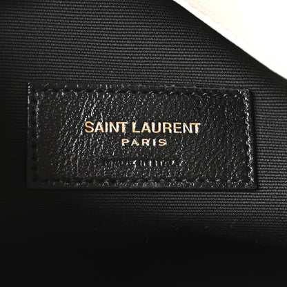 SAINT LAURENT Paris leather label on dark lining, embossed text
