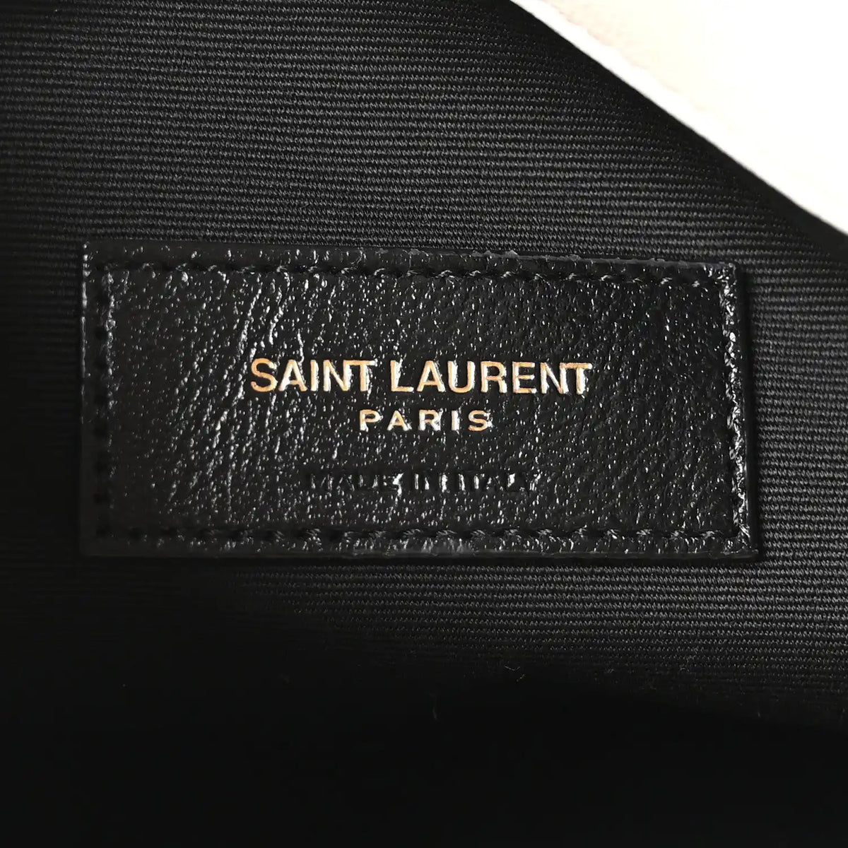 SAINT LAURENT Paris leather label on dark lining, embossed text