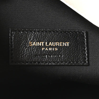 SAINT LAURENT Paris leather label on dark lining, embossed text
