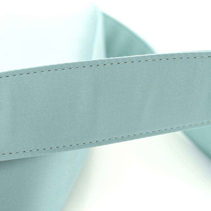 Light blue satin nappa baguette bag, front panel seam and curved edge