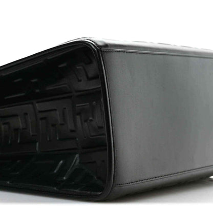 Black leather tote bag side view with smooth panel and embossed FF interior