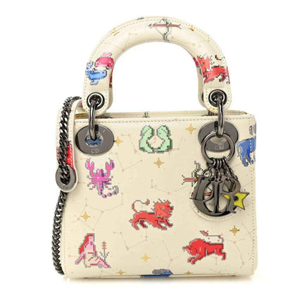 Mini Lady Dior bag in white pixel zodiac calfskin, top handles, chain strap, charms
