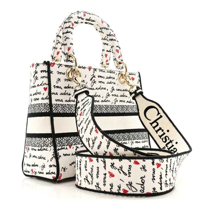 Christian Dior canvas handbag with black trim, “Je vous adore” print, red hearts