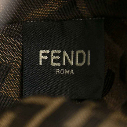 Close-up of FENDI Roma logo patch on dark bag lining.