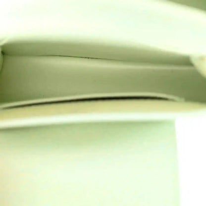 Mini Capucines handbag interior view with light green lining and side wall