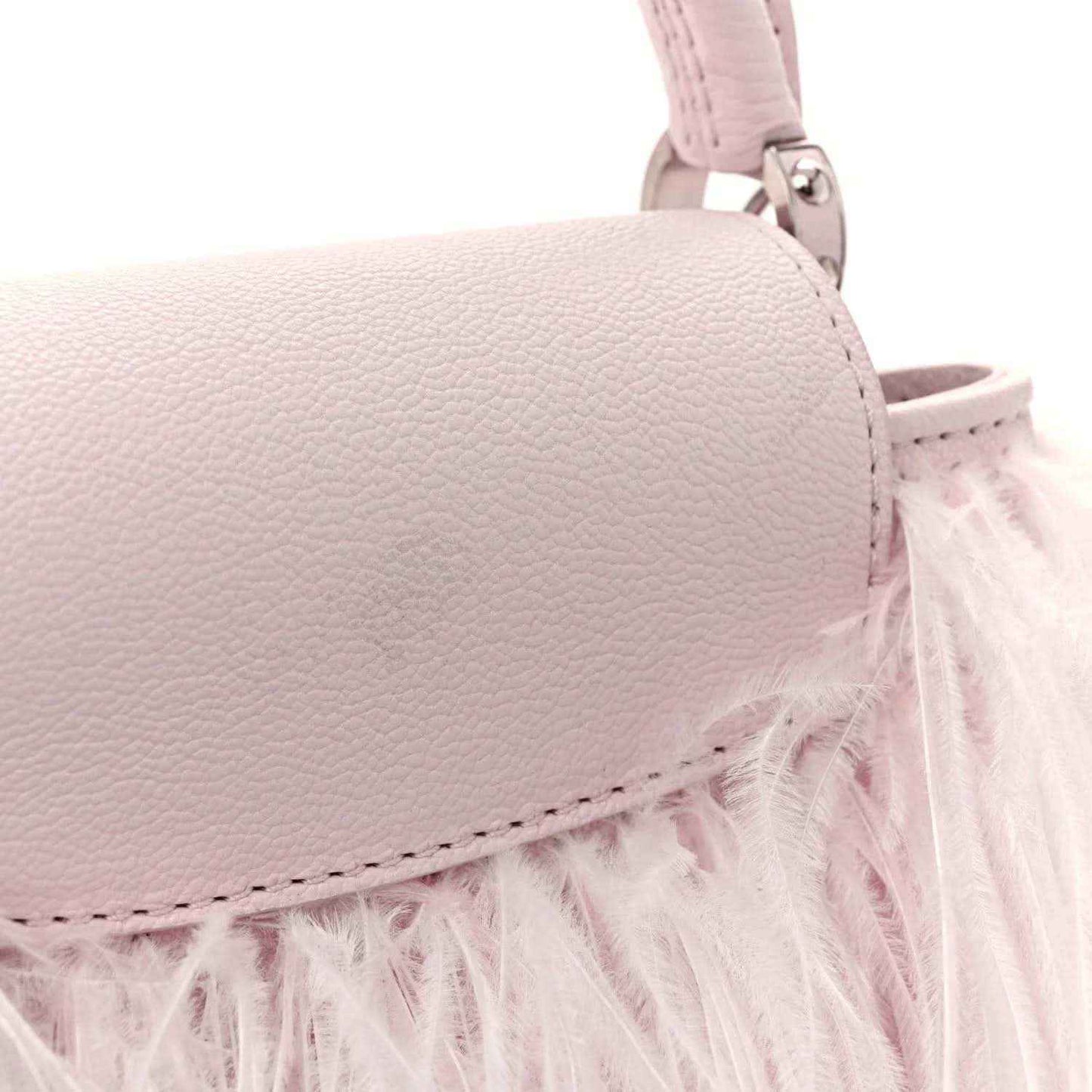 Pink textured mini top handle bag with feather trim and metal hardware