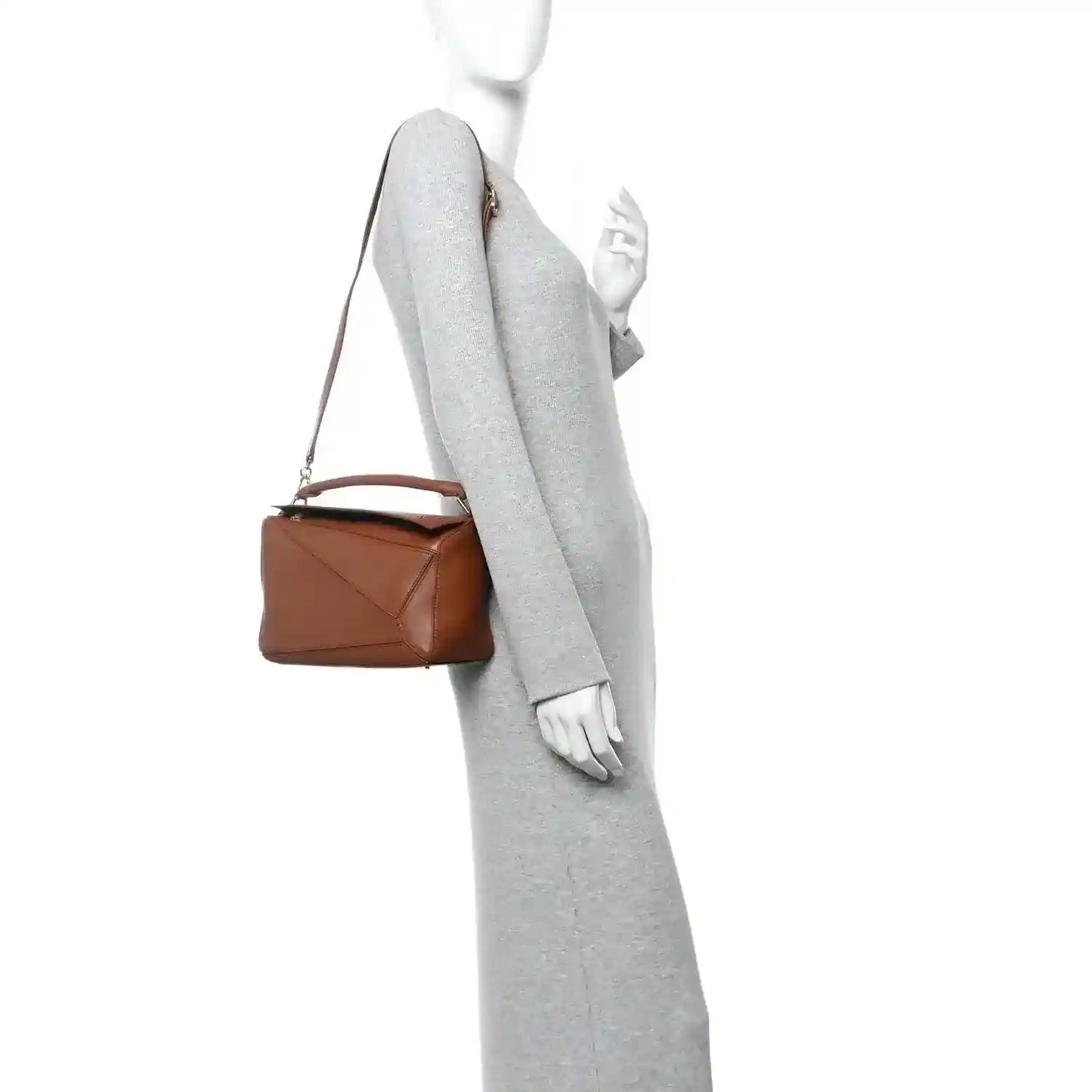 Small pecan brown leather bag with adjustable crossbody strap, gold hardware