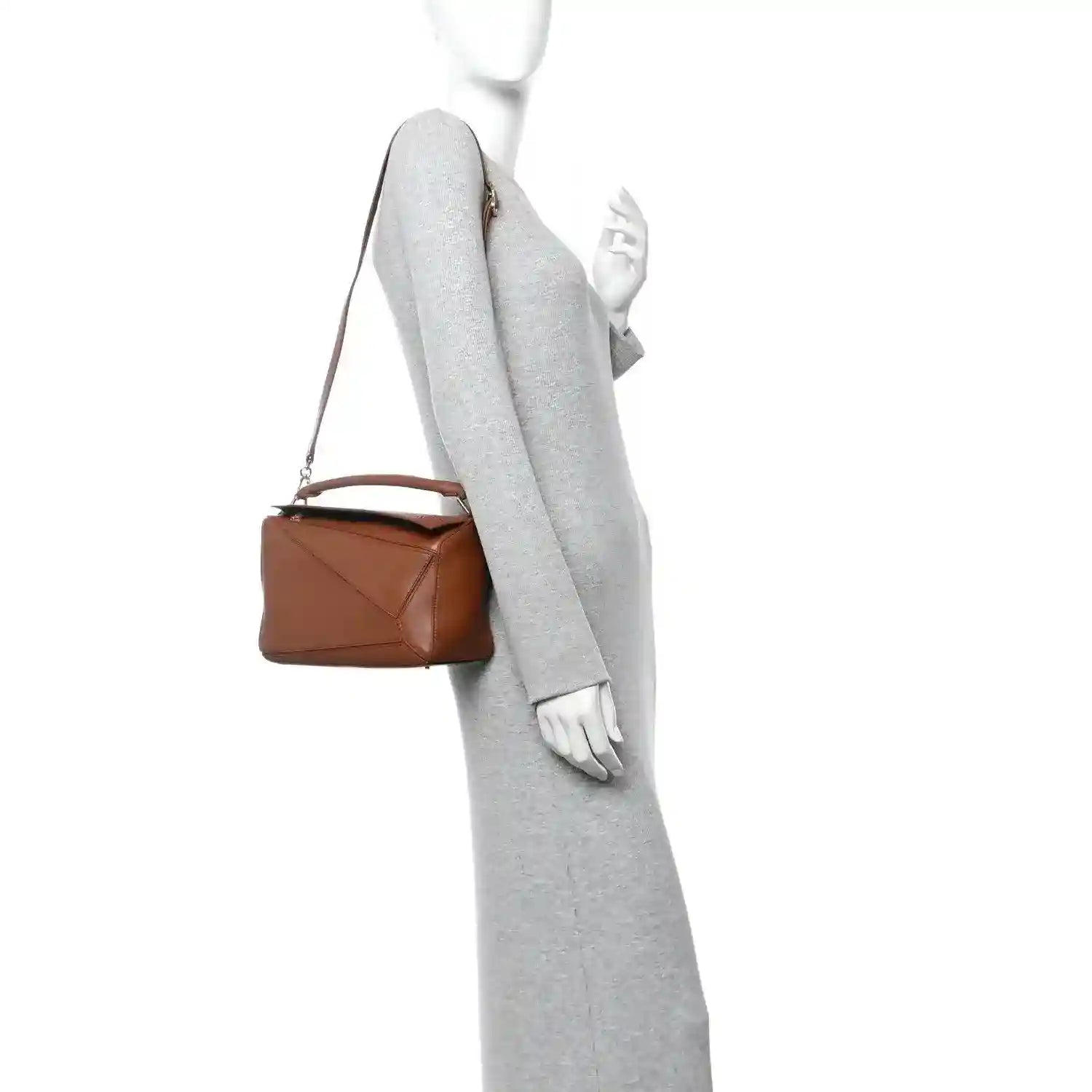 Small pecan brown leather bag with adjustable crossbody strap, gold hardware