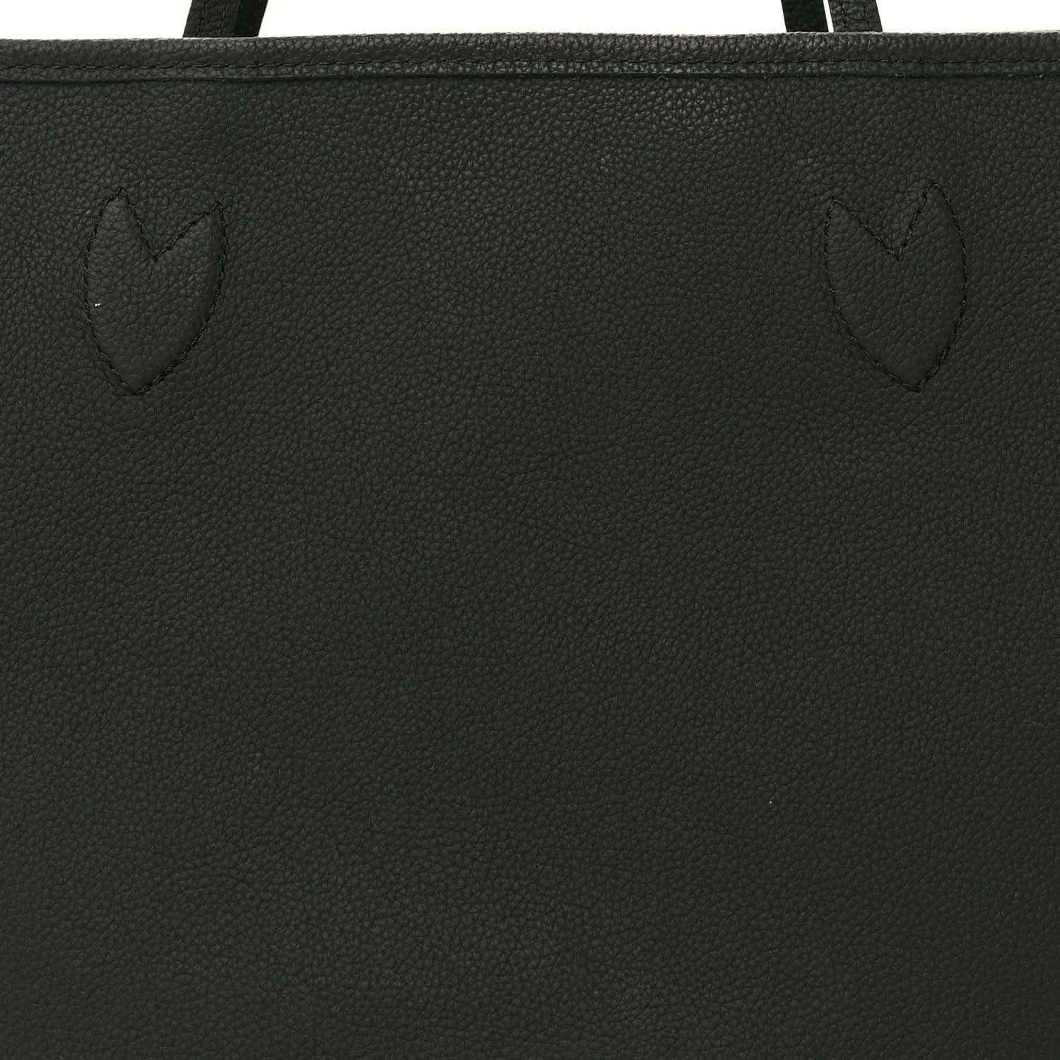 Black textured tote bag panel with stitched seam and embossed pattern