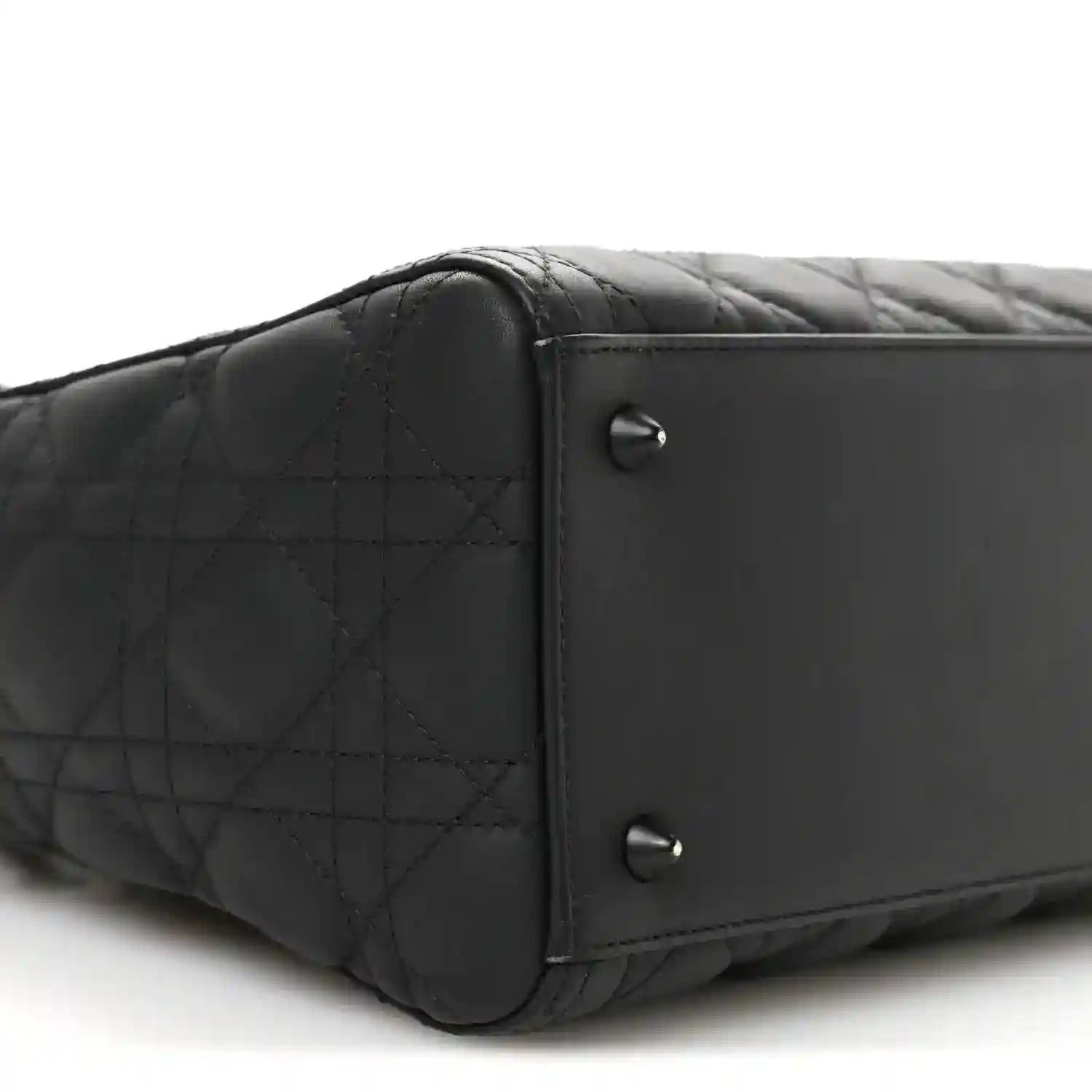 Black quilted Lady Dior bag end panel with two silver-tone rivets