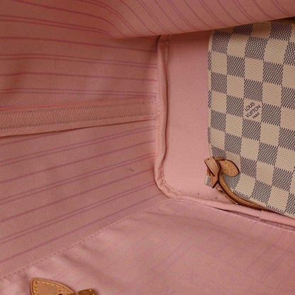 Louis Vuitton tote bag interior with light pink lining and side pocket