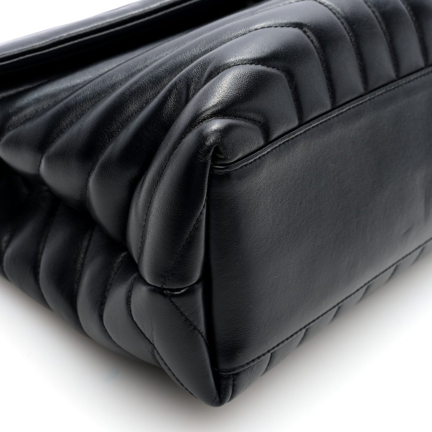 Black quilted calfskin satchel corner detail with curved flap trim