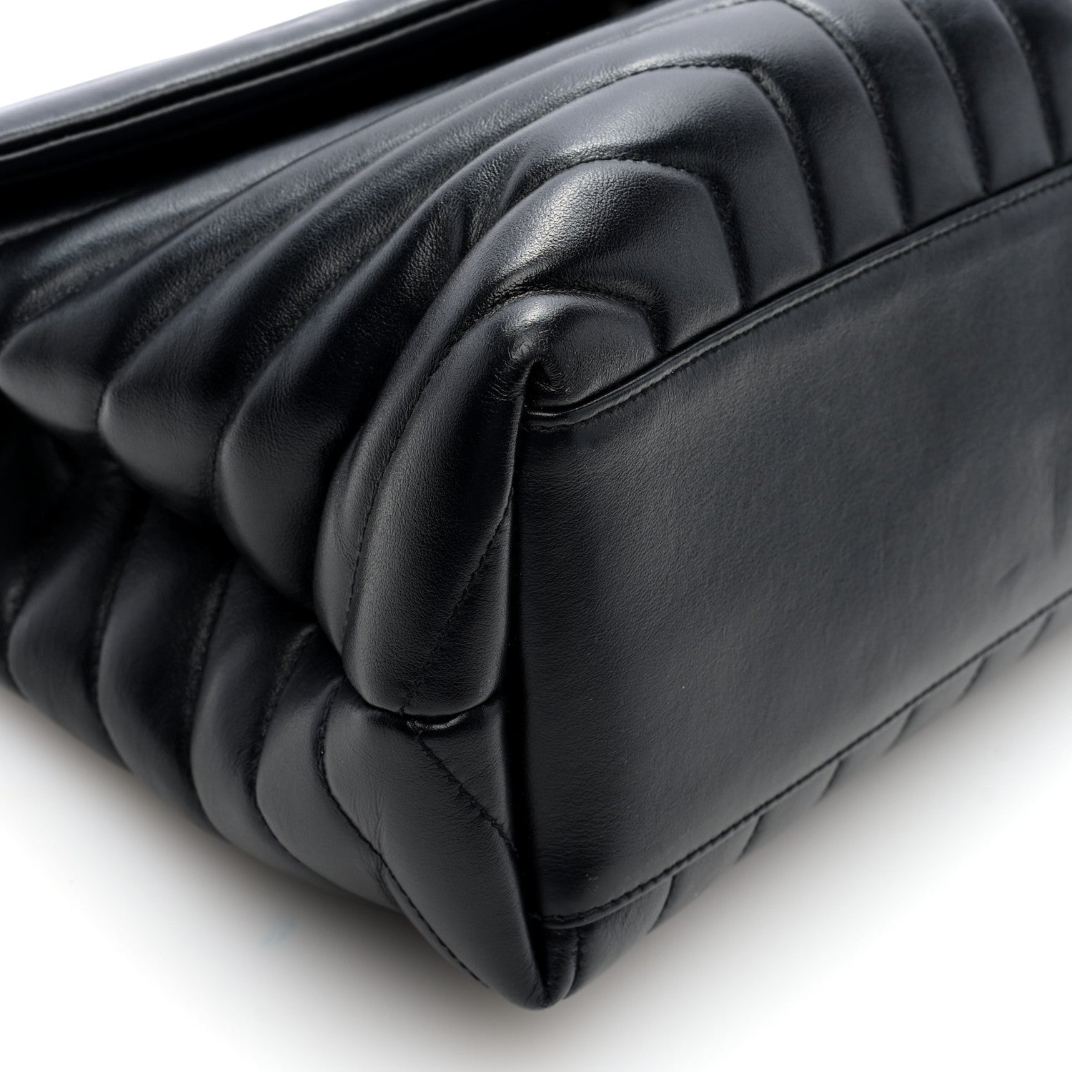 Black quilted calfskin satchel corner detail with curved flap trim