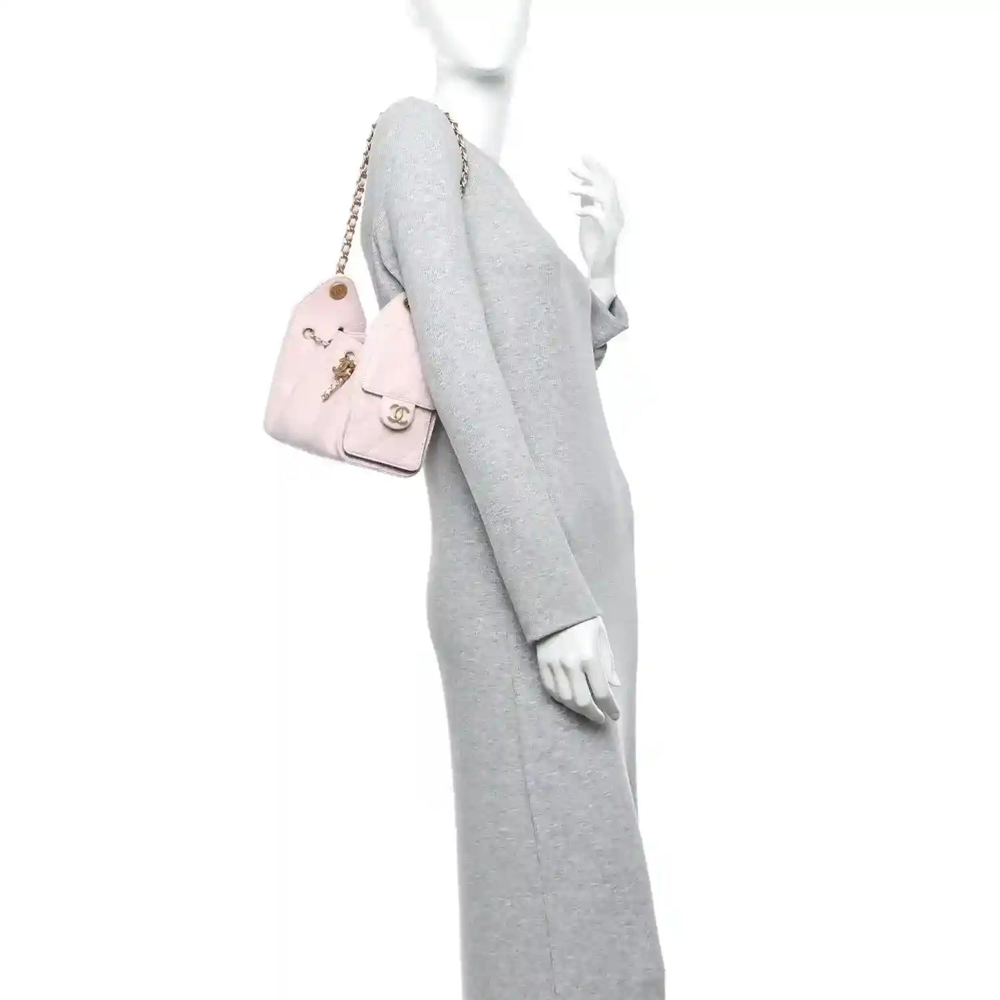 Chanel light pink quilted caviar mini 25 handbag with gold chain worn on shoulder