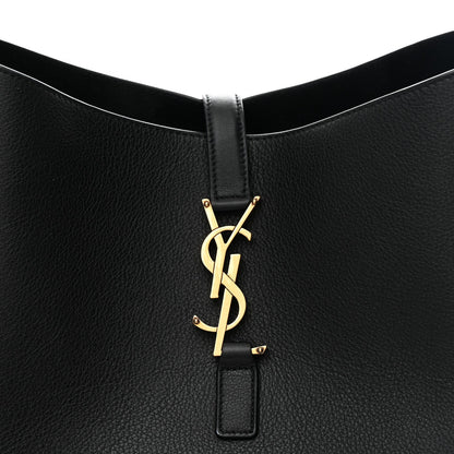 Black leather hobo bag front pocket with gold YSL logo on small leather tab