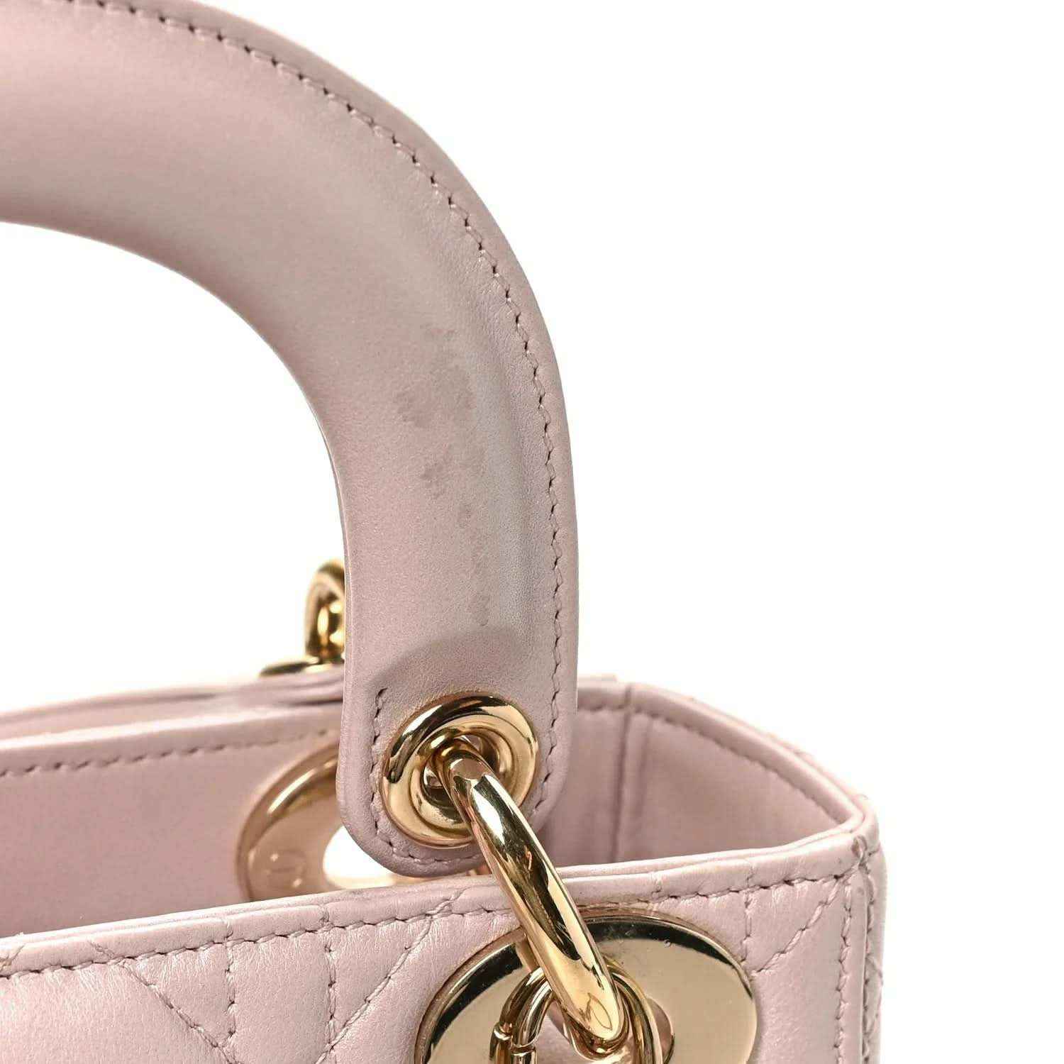 Mini Lady Dior handbag in light pink lambskin with gold-tone top handle clasp