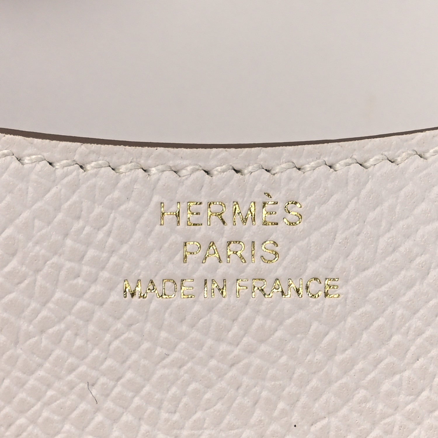 HERMÈS PARIS MADE IN FRANCE embossing on light gray leather