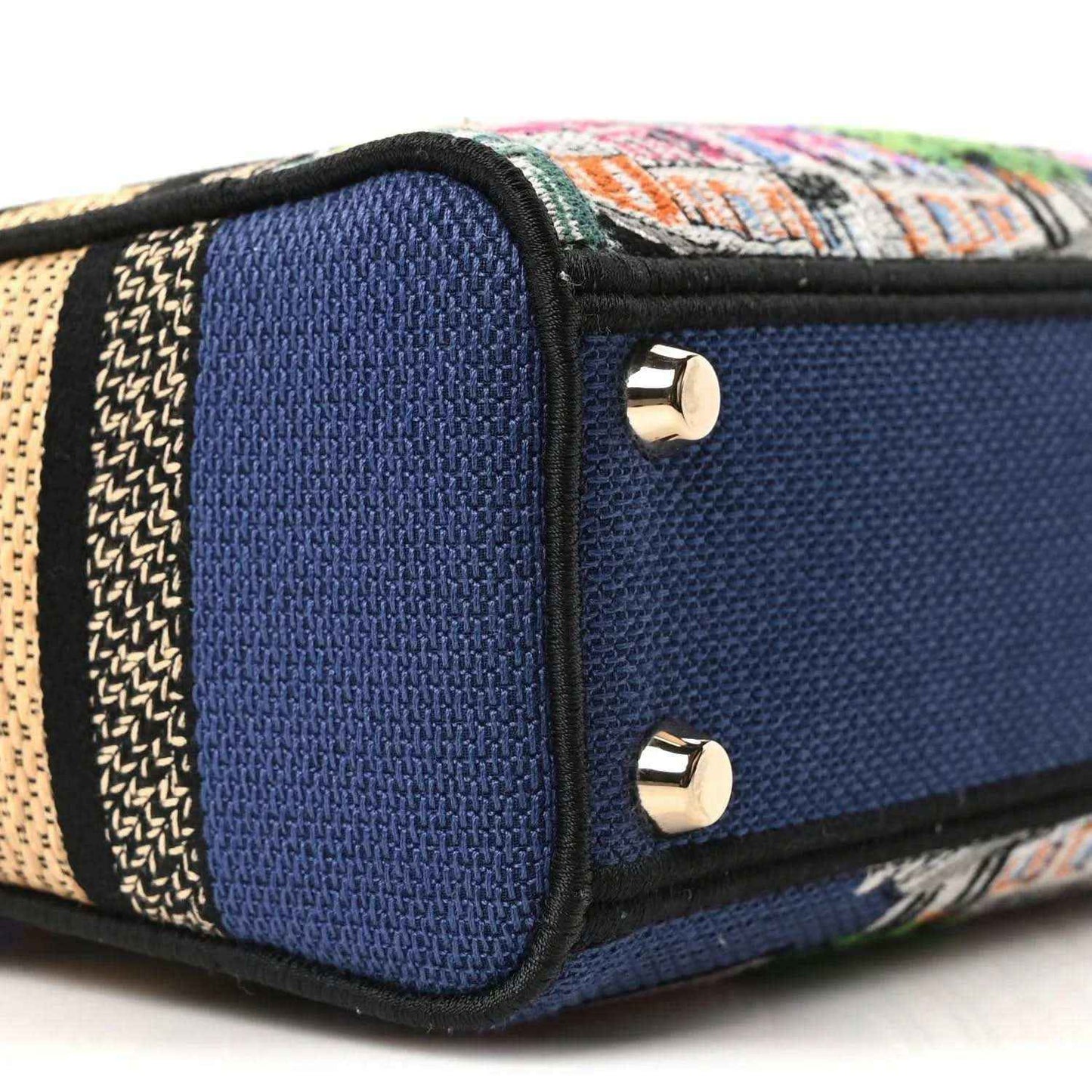 Blue handbag end panel with gold screw studs and multicolor embroidered trim