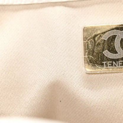 Pristine white quilted caviar leather panel detail with small logo patch corner