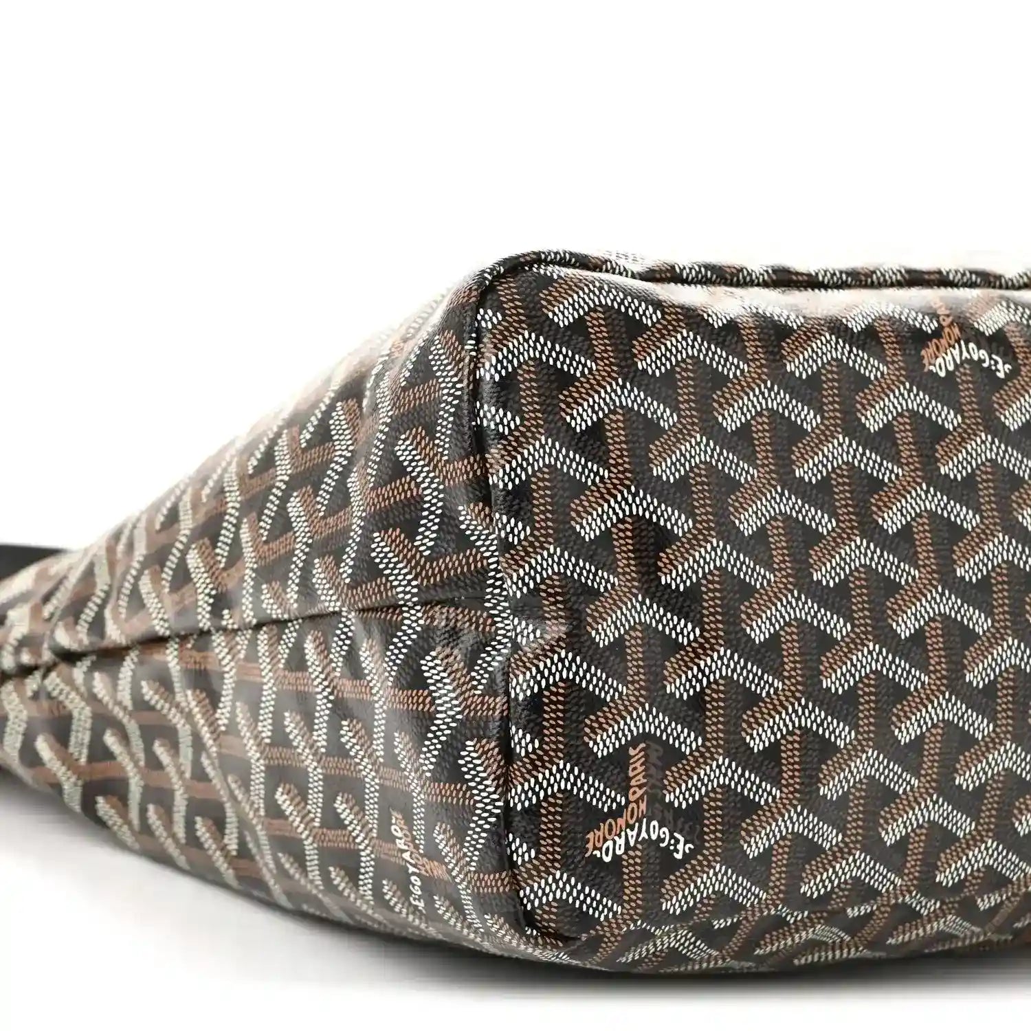 Chevron-pattern hobo bag corner with folded edge and repeating monogram print
